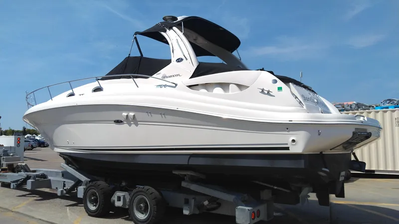 Barely "a" Wake Yacht Photos Pics 2004 Sea Ray 340 Sundancer boat on a trailer in a marina.