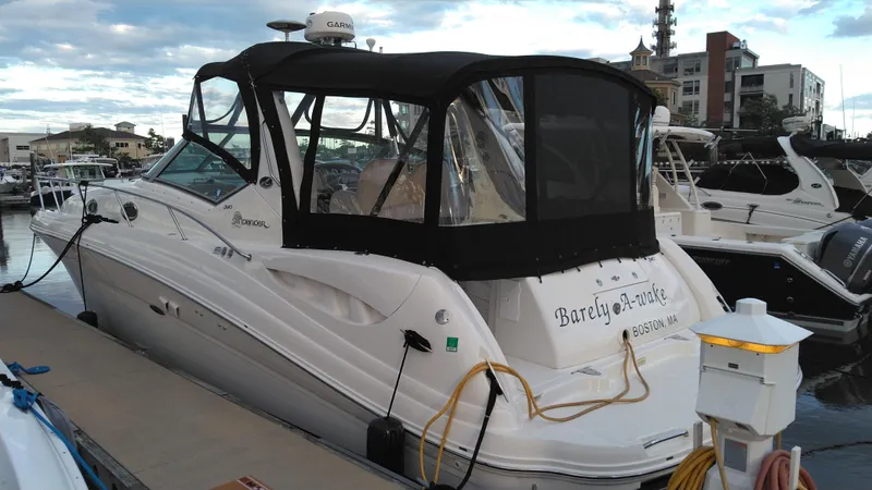 Barely "a" Wake Yacht Photos Pics 2004 Sea Ray 340 Sundancer docked at a marina with black canvas cover.
