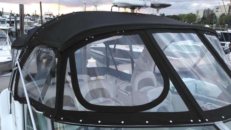 Barely "a" Wake Yacht Photos Pics 2004 Sea Ray 340 Sundancer with black canvas enclosure at marina.