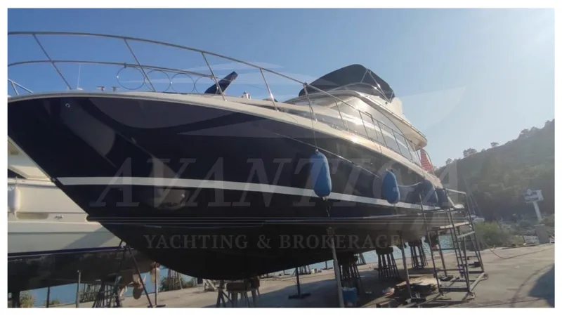  Yacht Photos Pics 2010 Meridian 541 Sedan yacht on dry dock, side view with clear sky.