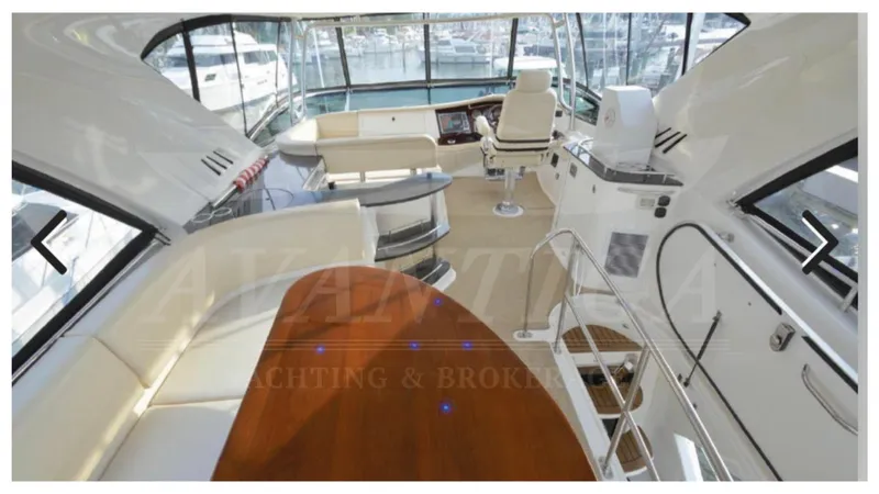  Yacht Photos Pics Luxurious interior of a 2010 Meridian 541 Sedan yacht with elegant seating and helm.
