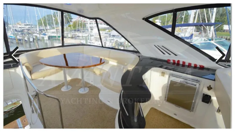  Yacht Photos Pics Interior of 2010 Meridian 541 Sedan yacht with seating and table.