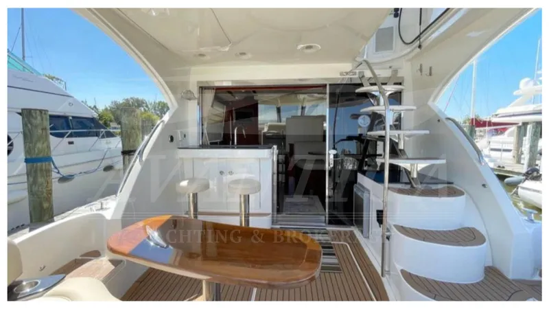  Yacht Photos Pics 2010 Meridian 541 Sedan yacht interior with modern seating and spiral staircase.