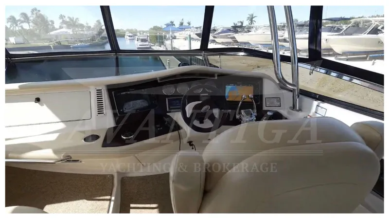  Yacht Photos Pics Interior cockpit of 2010 Meridian 541 Sedan yacht with navigation controls and seating.