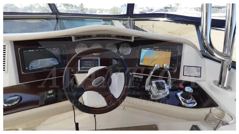  Yacht Photos Pics 2010 Meridian 541 Sedan yacht dashboard with navigation screens and steering wheel.