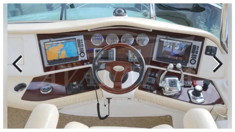  Yacht Photos Pics Helm of 2010 Meridian 541 Sedan with navigation screens and controls.