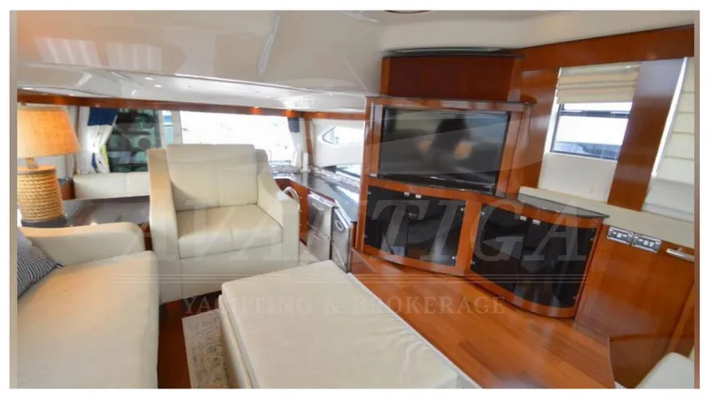  Yacht Photos Pics Luxurious interior of 2010 Meridian 541 Sedan yacht with modern furnishings and entertainment system.