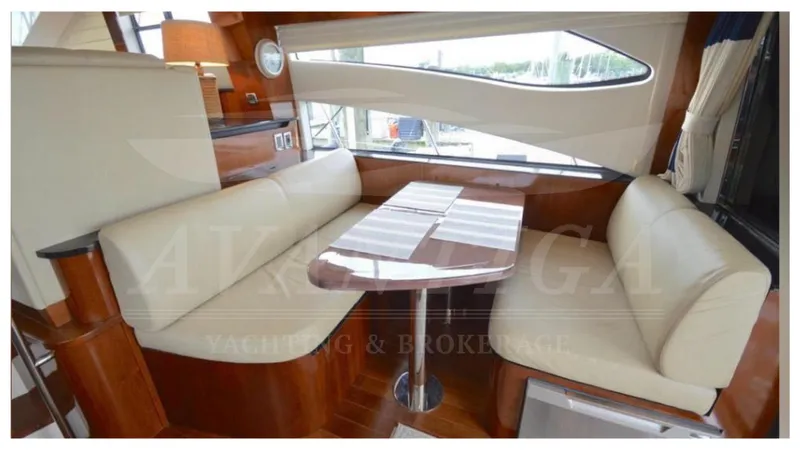  Yacht Photos Pics Luxurious interior of 2010 Meridian 541 Sedan yacht with elegant seating and dining area.
