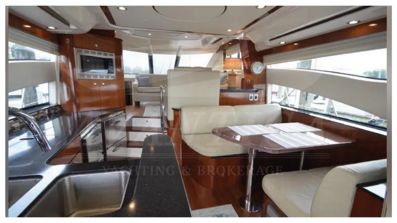  Yacht Photos Pics Luxurious interior of 2010 Meridian 541 Sedan yacht with modern kitchen and dining area.