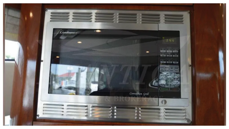  Yacht Photos Pics Built-in microwave in 2010 Meridian 541 Sedan yacht kitchen.