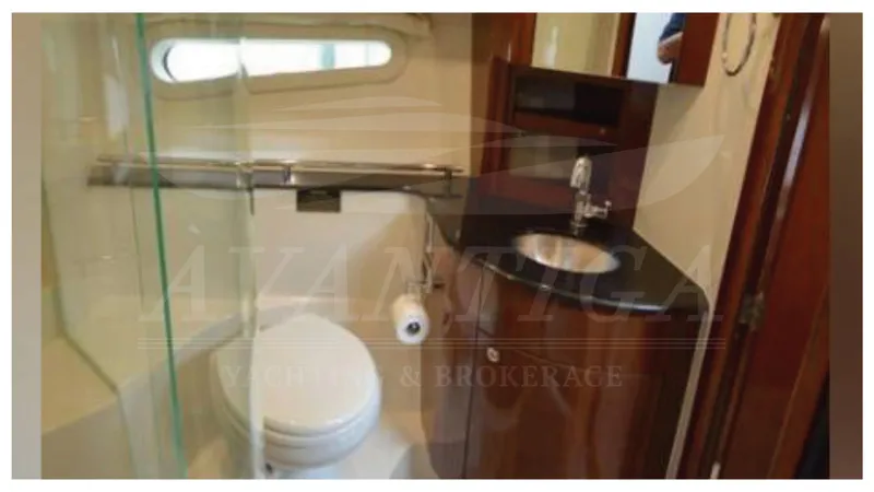  Yacht Photos Pics 2010 Meridian 541 Sedan bathroom with modern fixtures and compact design.