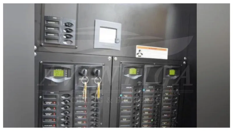  Yacht Photos Pics Electrical panel of a 2010 Meridian 541 Sedan yacht with control switches and key access.