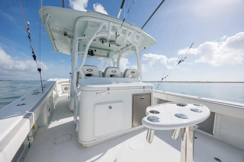  Yacht Photos Pics 2014 Yellowfin 42 Offshore boat interior with fishing rod holders and seating.