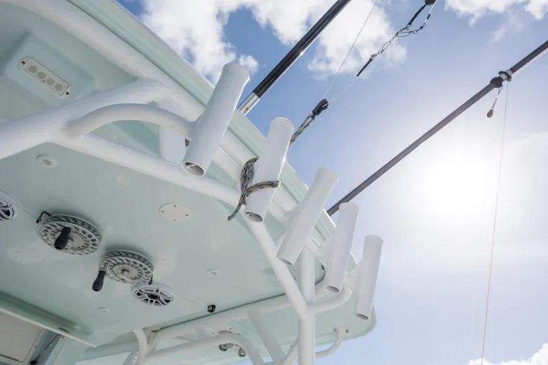  Yacht Photos Pics 2014 Yellowfin 42 Offshore boat with rod holders and reels under sunny sky.