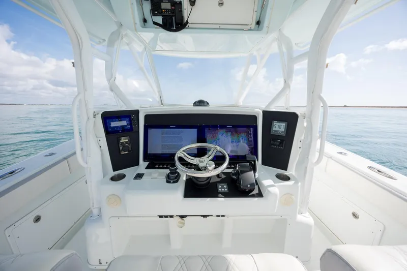  Yacht Photos Pics 2014 Yellowfin 42 Offshore boat helm with advanced navigation system and ocean view.
