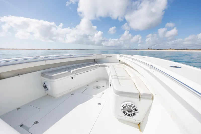  Yacht Photos Pics 2014 Yellowfin 42 Offshore boat interior with seating, under a bright blue sky.