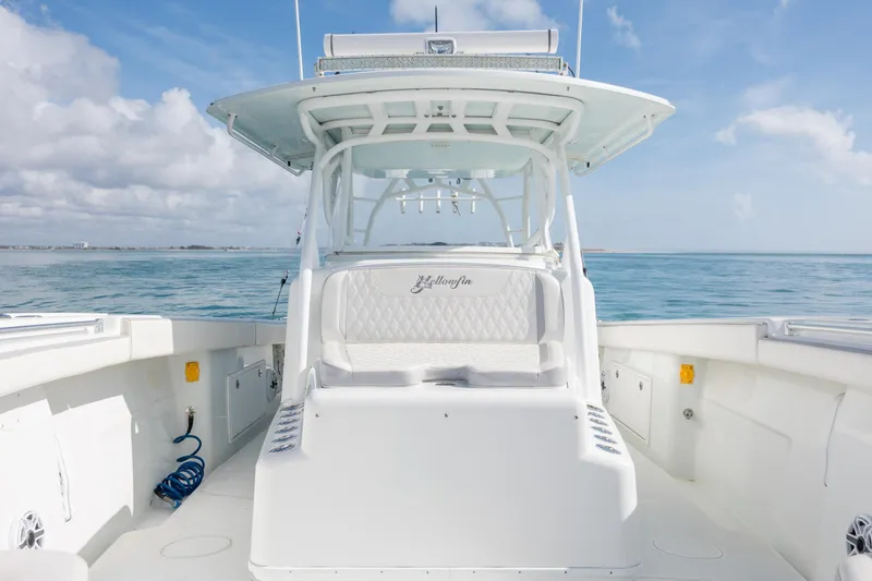  Yacht Photos Pics 2014 Yellowfin 42 Offshore boat on calm ocean waters under a clear sky.