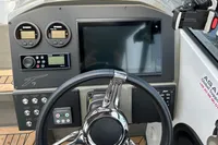 Steering console of 2022 Finnmaster T7 boat with modern controls and display.