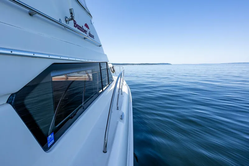 Bumber Shoot Yacht Photos Pics 2006 Silverton 42 Convertible yacht cruising on calm blue waters.
