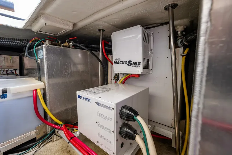 Bumber Shoot Yacht Photos Pics Engine room of 2006 Silverton 42 Convertible with electrical components and wiring.