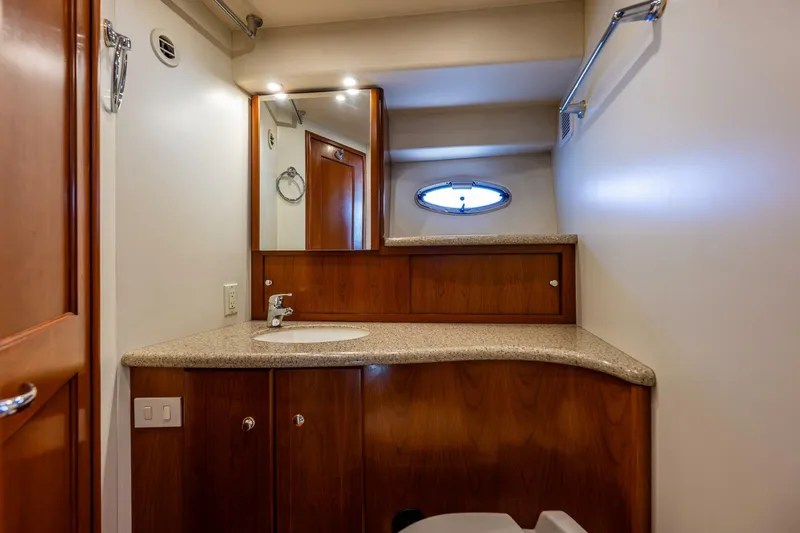 Bumber Shoot Yacht Photos Pics Luxurious bathroom interior of 2006 Silverton 42 Convertible yacht with wooden cabinetry.