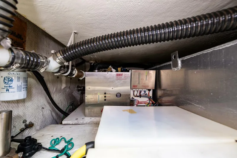 Bumber Shoot Yacht Photos Pics Engine room of a 2006 Silverton 42 Convertible yacht, showcasing mechanical components.