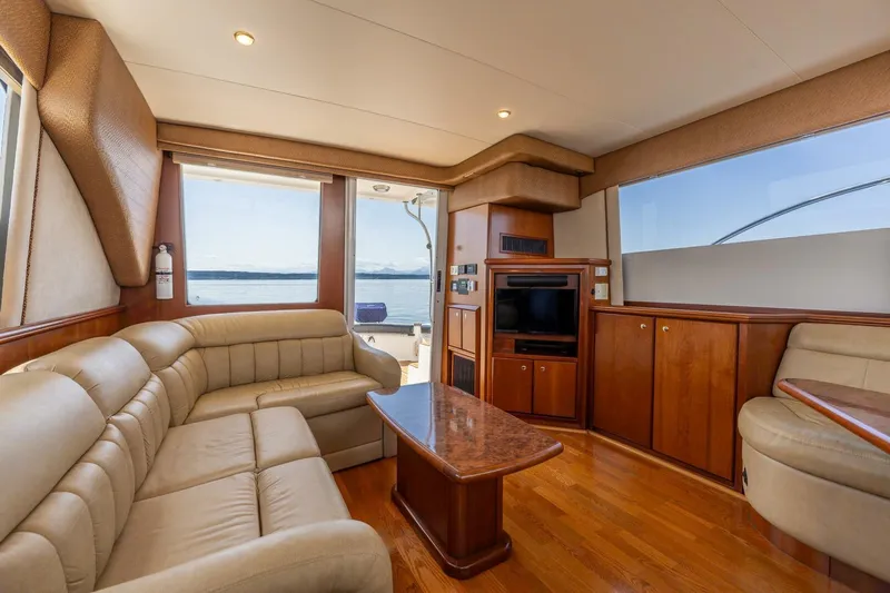 Bumber Shoot Yacht Photos Pics Luxurious interior of 2006 Silverton 42 Convertible yacht with leather seating and wood finishes.