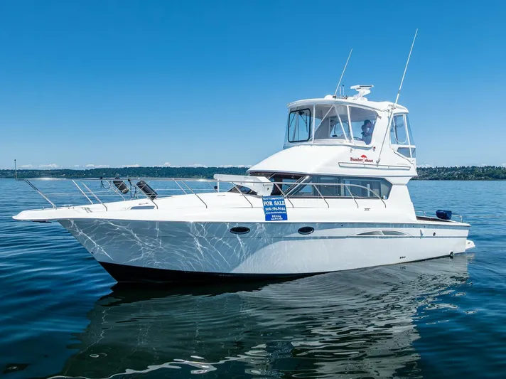 Bumber Shoot Yacht Photos Pics 2006 Silverton 42 Convertible yacht on calm water, clear blue sky.