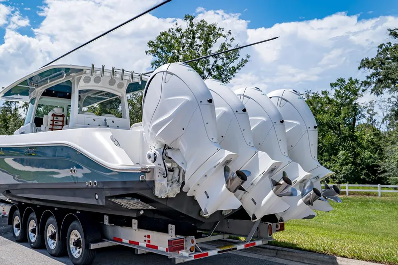  Yacht Photos Pics 2021 HCB Lujo boat with four powerful outboard engines on a trailer.