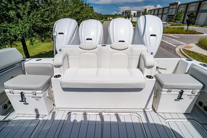  Yacht Photos Pics 2021 HCB Lujo boat with white seating and powerful outboard engines.