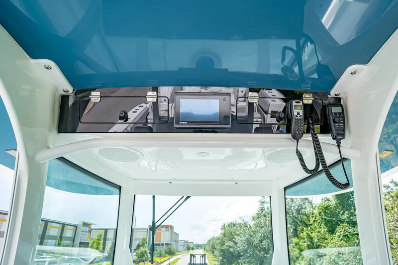  Yacht Photos Pics Interior view of 2021 HCB Lujo boat cockpit with control panel and communication devices.