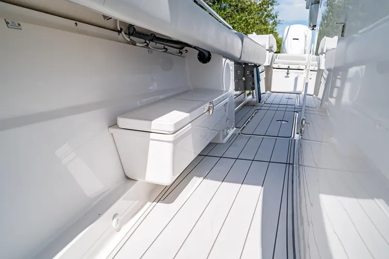  Yacht Photos Pics 2021 HCB Lujo boat interior with sleek white seating and storage compartments.