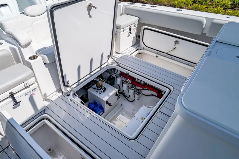  Yacht Photos Pics 2021 HCB Lujo boat interior with open storage compartments and visible equipment.