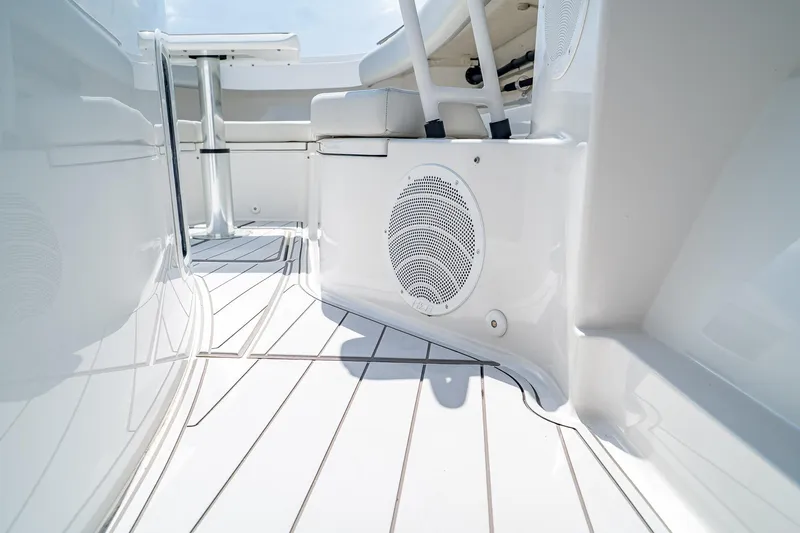 Yacht Photos Pics 2021 HCB Lujo boat interior with sleek white design and integrated speaker system.