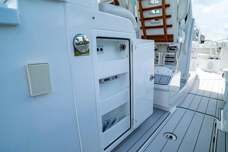  Yacht Photos Pics 2021 HCB Lujo yacht interior with open storage compartment and sleek seating.