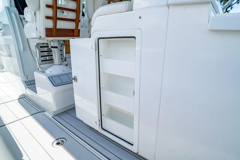  Yacht Photos Pics 2021 HCB Lujo boat interior with open storage compartment and seating.