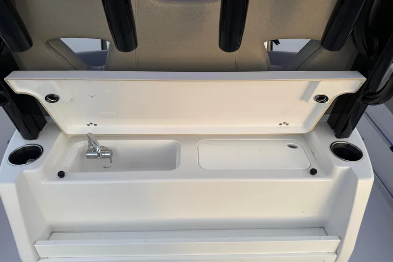 Reel Ruthless Yacht Photos Pics 2022 Sportsman Open 322 Center Console boat sink and storage area.