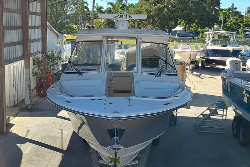 325-719 Brokerage Josh Yacht Photos Pics 2021 Grady-White Freedom 325 boat in a marina, featuring Garmin equipment.