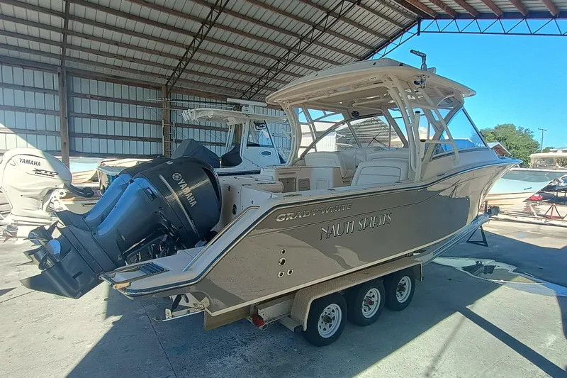 325-719 Brokerage Josh Yacht Photos Pics 2021 Grady-White Freedom 325 boat with Yamaha engines in a covered storage area.