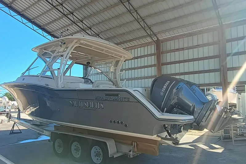 325-719 Brokerage Josh Yacht Photos Pics 2021 Grady-White Freedom 325 boat on trailer in covered storage.