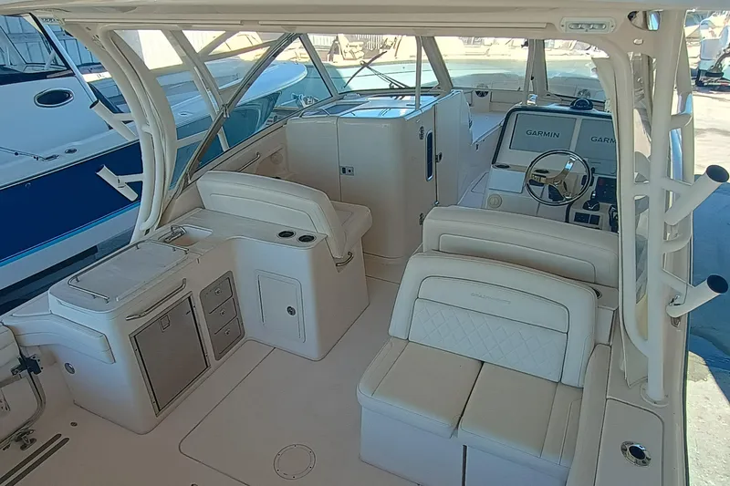 325-719 Brokerage Josh Yacht Photos Pics 2021 Grady-White Freedom 325 boat interior with seating and Garmin navigation system.