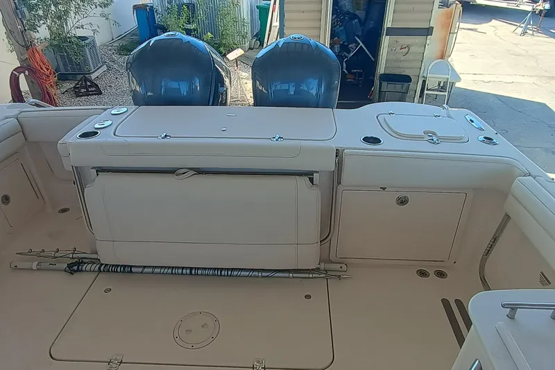 325-719 Brokerage Josh Yacht Photos Pics 2021 Grady-White Freedom 325 boat interior with dual engines and storage compartments.