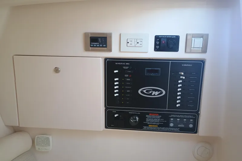 325-719 Brokerage Josh Yacht Photos Pics Control panel of a 2021 Grady-White Freedom 325 boat, featuring various switches and alerts.