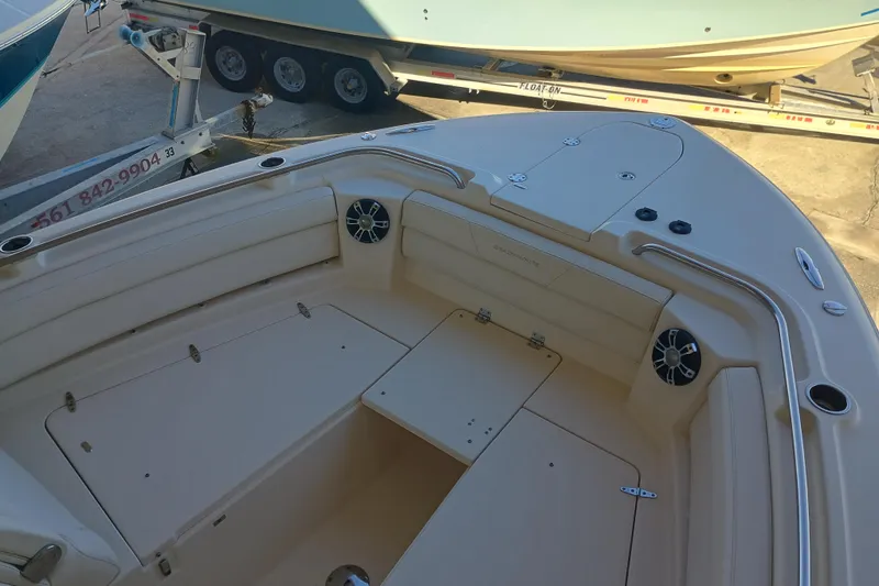 325-719 Brokerage Josh Yacht Photos Pics 2021 Grady-White Freedom 325 boat interior with seating and storage compartments.