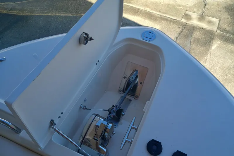 325-719 Brokerage Josh Yacht Photos Pics Anchor compartment of 2021 Grady-White Freedom 325 boat, open lid, showing anchor mechanism.