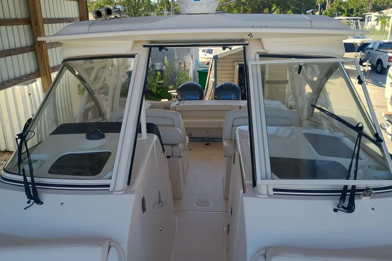 325-719 Brokerage Josh Yacht Photos Pics 2021 Grady-White Freedom 325 boat interior with dual consoles and seating.