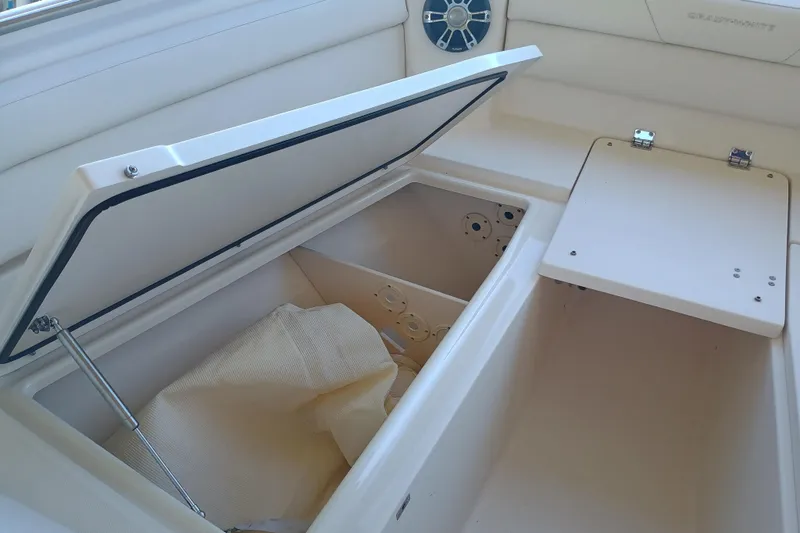 325-719 Brokerage Josh Yacht Photos Pics Open storage compartment on 2021 Grady-White Freedom 325 boat interior.