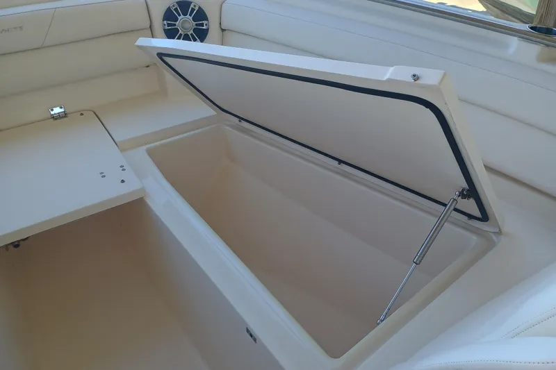 325-719 Brokerage Josh Yacht Photos Pics Open storage compartment on 2021 Grady-White Freedom 325 boat interior.