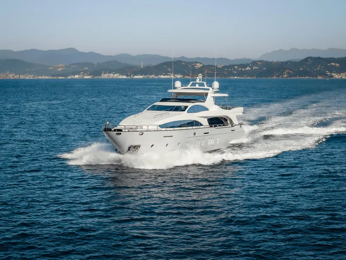 Serendipity Yacht Photos Pics Luxury 2008 Azimut 116 yacht cruising on open sea with scenic mountain backdrop.