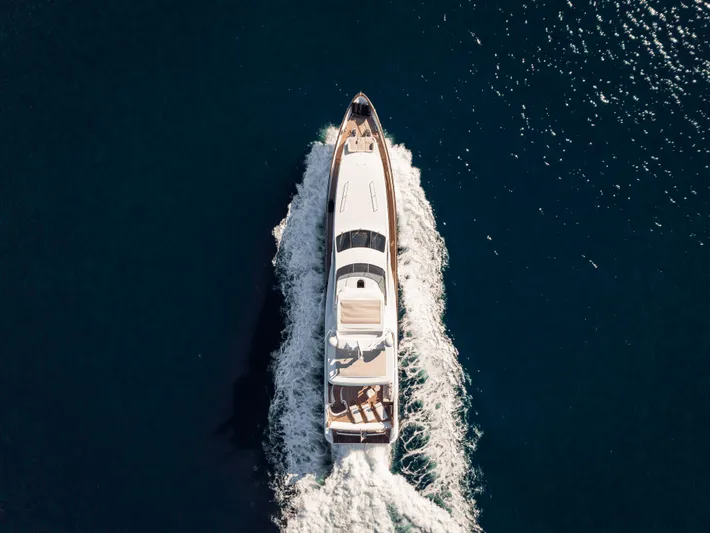 Serendipity Yacht Photos Pics Aerial view of 2008 Azimut 116 yacht cruising on open water.